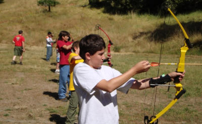 Picture of cub scouts at the archery range