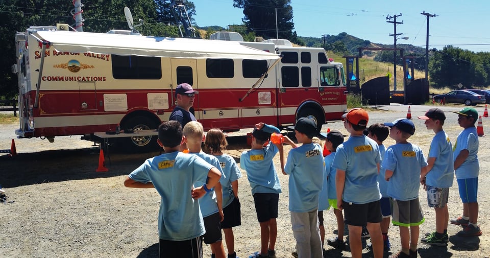 Cubs at Day Camp learning about a Fire District's communications truck