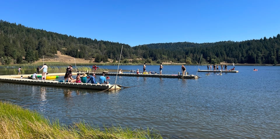 Picture of people fishing from lakeside docks Picture of people fishing from lakeside docks